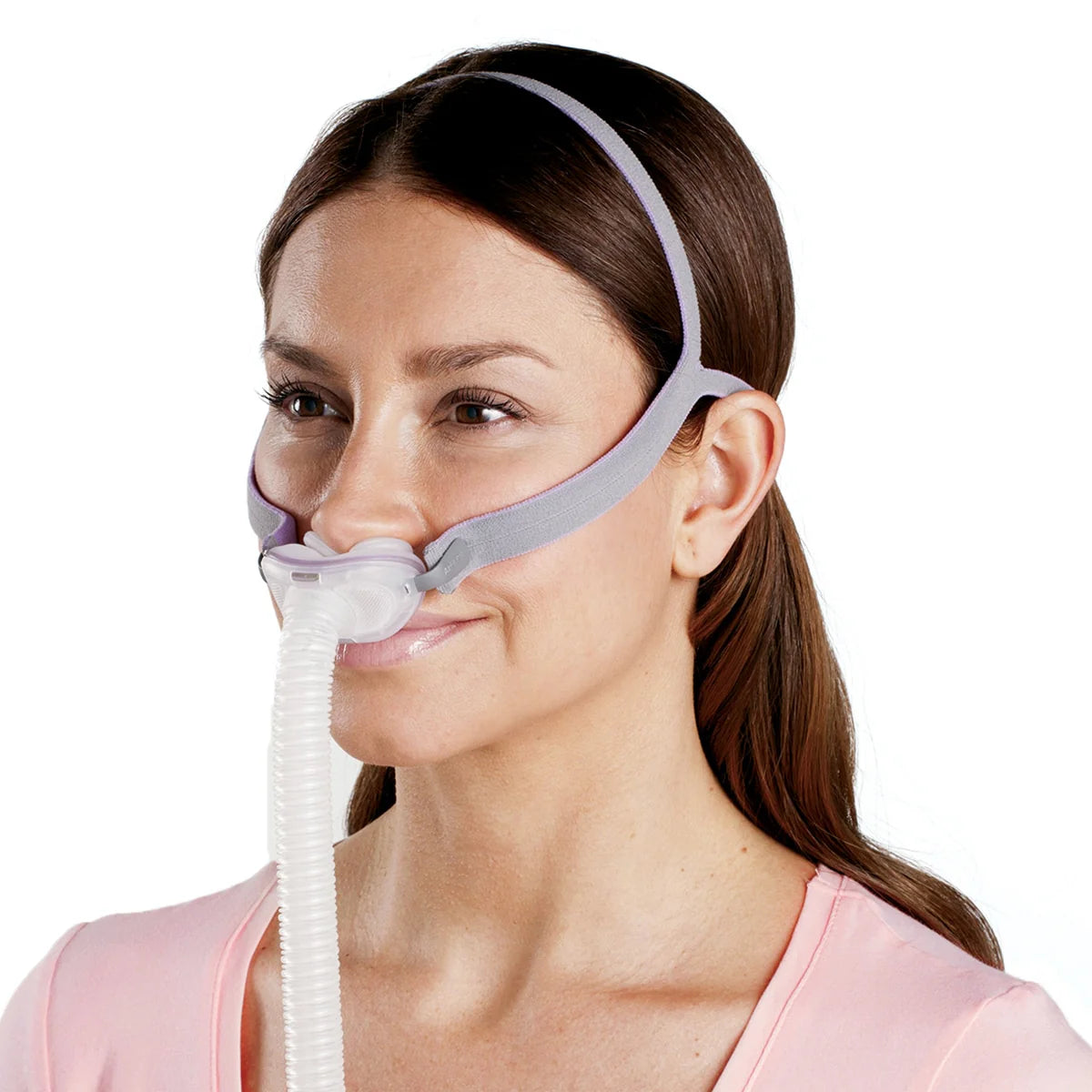 Woman wearing a CPAP mask on a white background